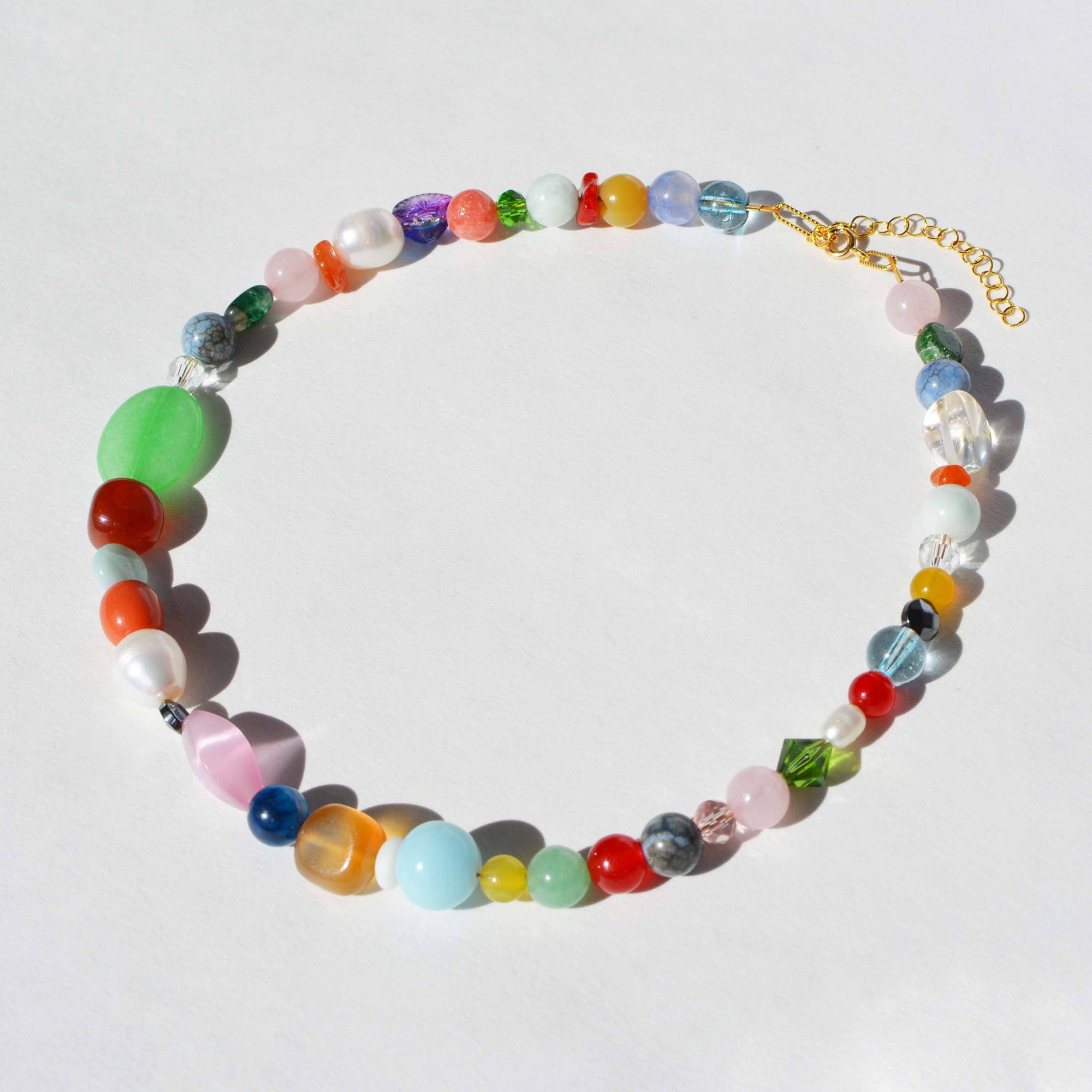 Colorful beaded necklace on a white background