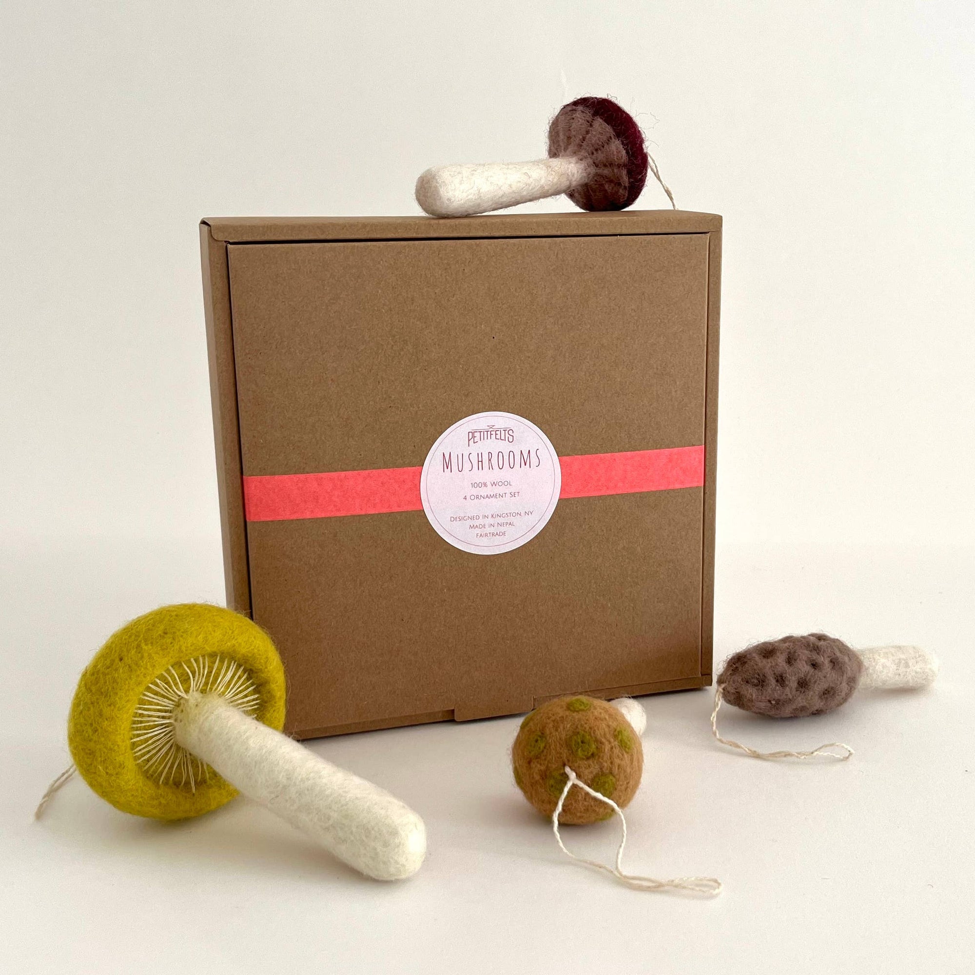 Mushroom-shaped ornament and a cardboard box on a white background