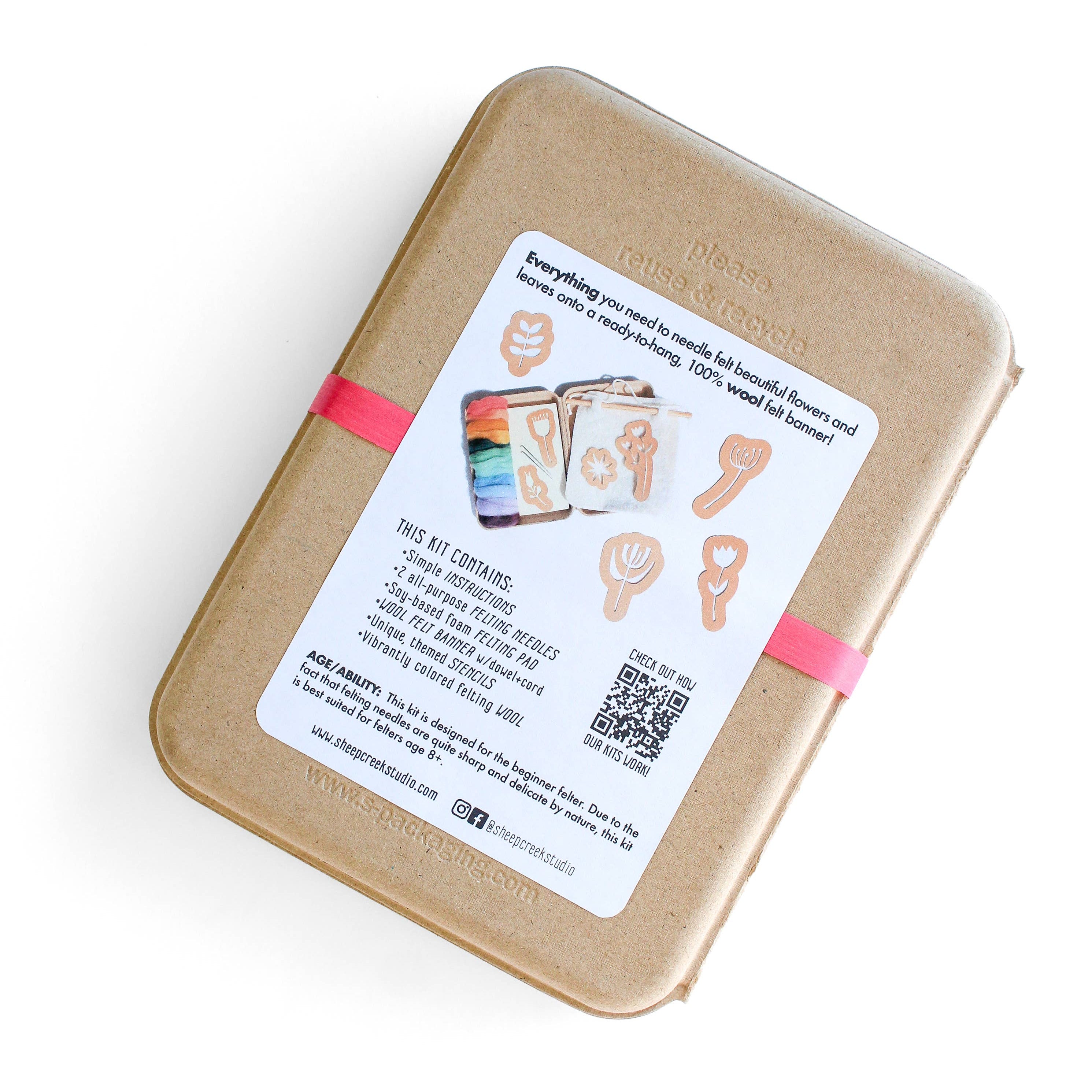 Brown cardboard box with a label and QR code on a white background