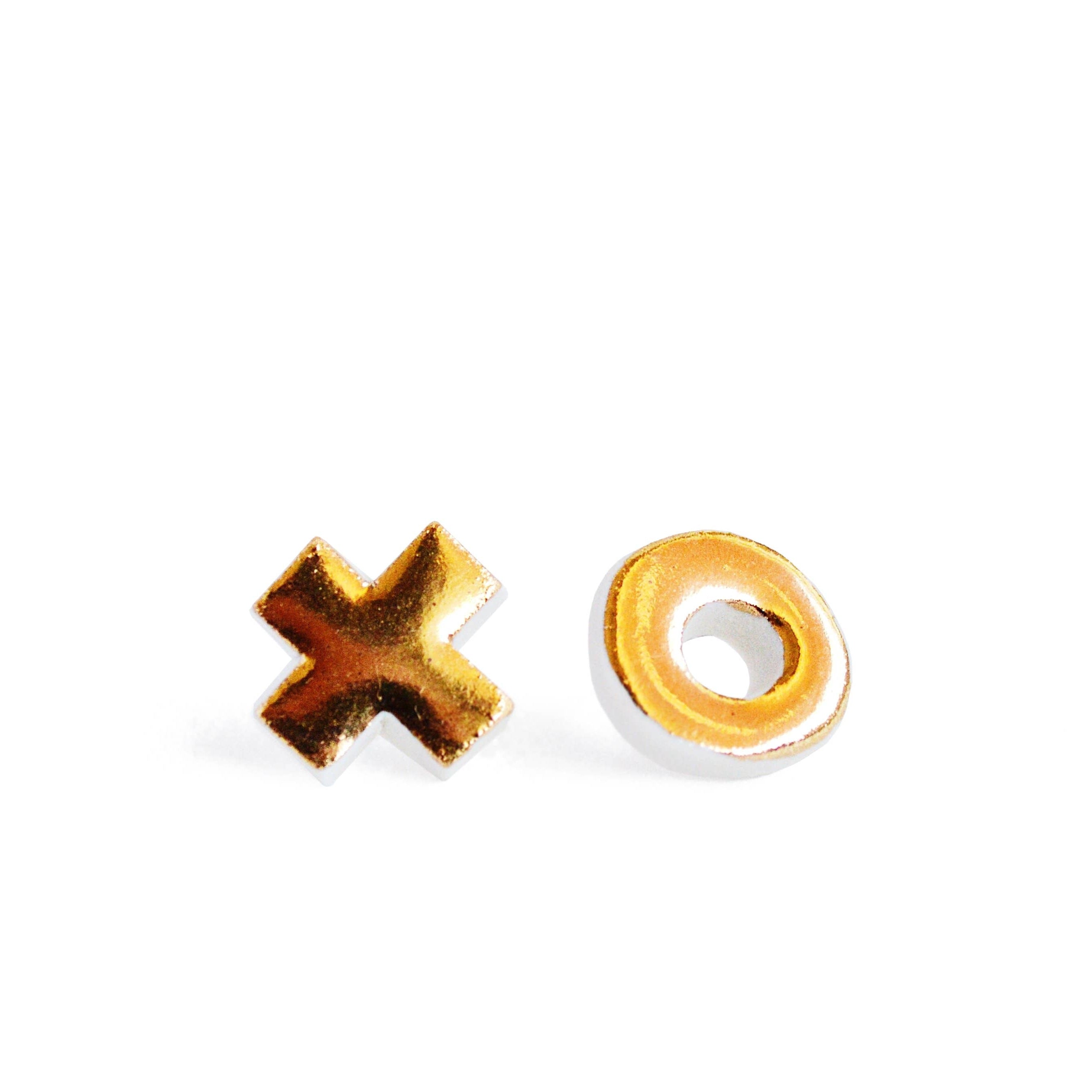 Gold 'X' and 'O' earrings on a white background