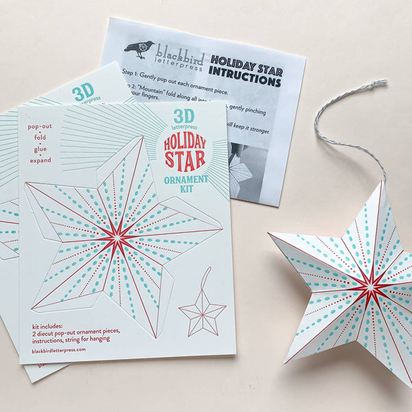 3D holiday star ornament kit with instructions on a light beige background