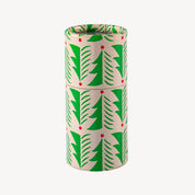 Cylindrical container with green leaf pattern on a white background