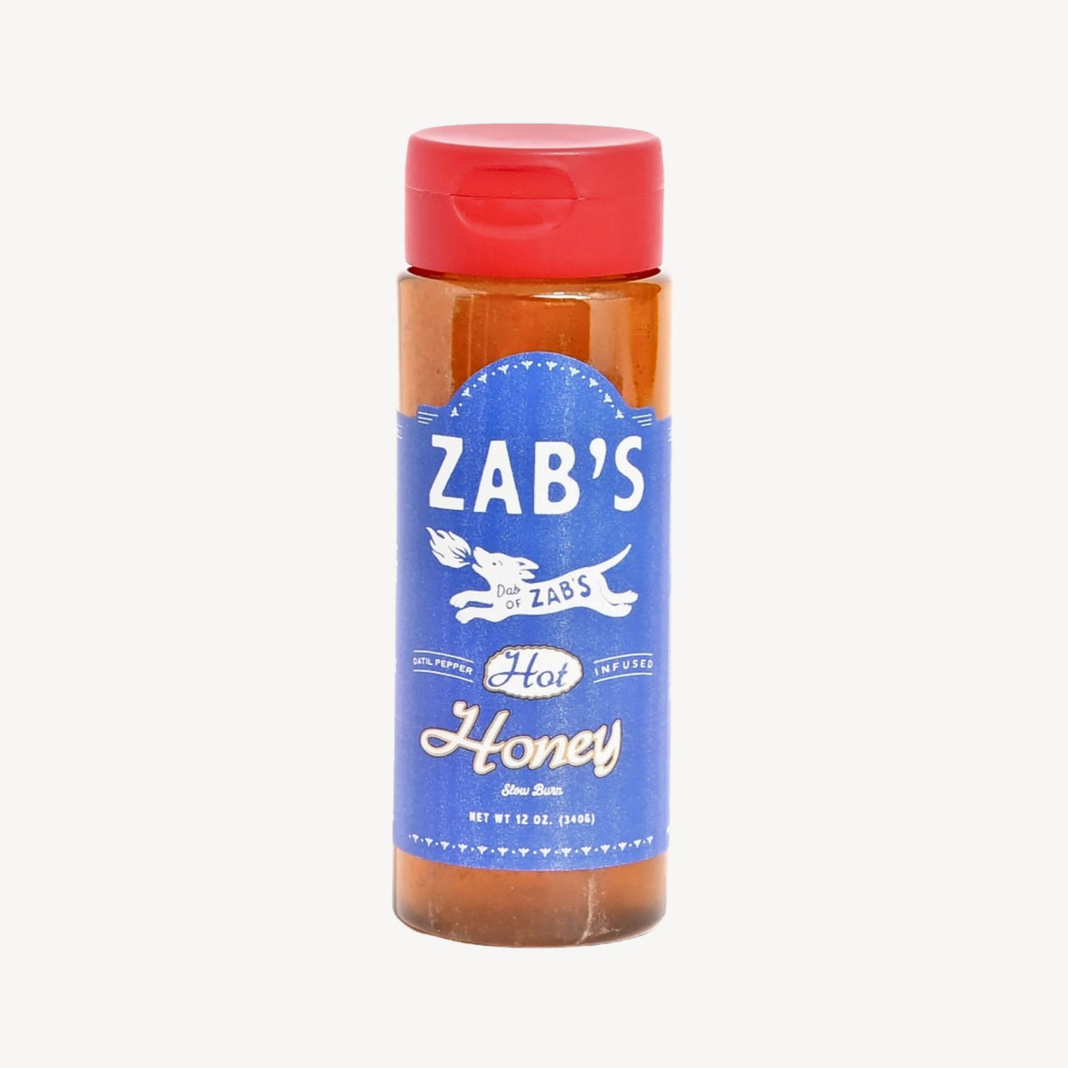 A bottle of Zab's Hot Honey mustard sauce with a red cap and a blue label, shown on a light gray background.
