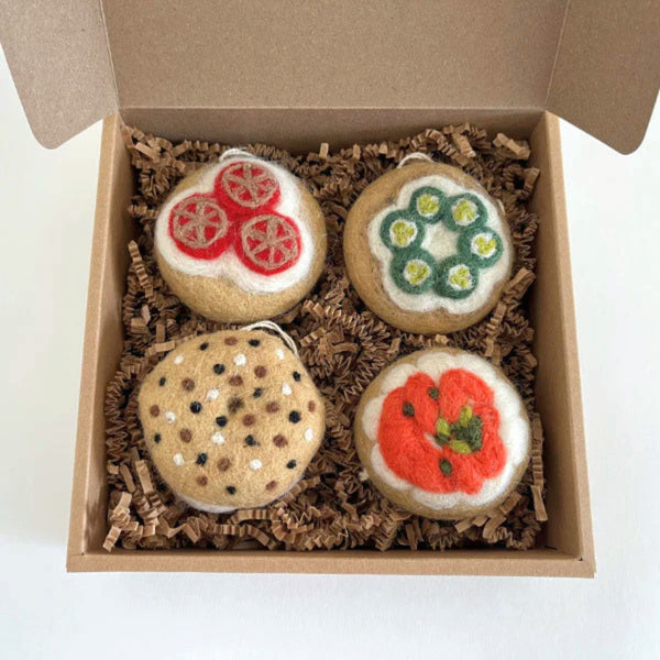 A box of bagel shaped felt holiday ornaments