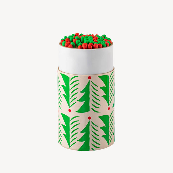 Decorative cylindrical container with green and red pattern on a white background