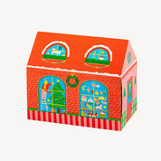 Colorful matchbox in the shape of a  house with window designs on a white background