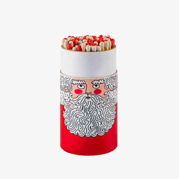 Matches in a cylindrical container with a Santa Claus design on a white background