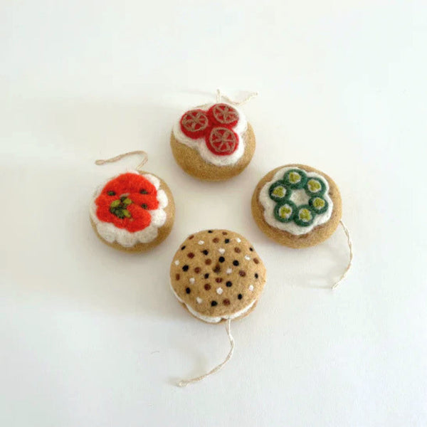A box of bagel shaped felt holiday ornaments