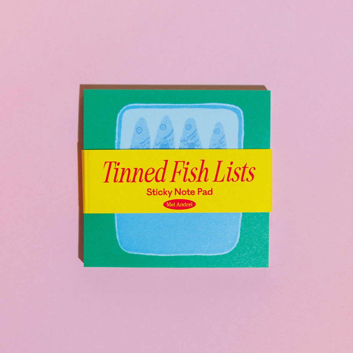 Sticky note pad with 'Tinned Fish Lists' text on a pink background