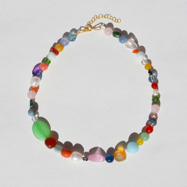 Multicolored beaded necklace on a light gray background
