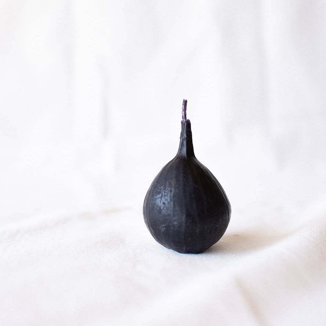 Black fig candle on a white background