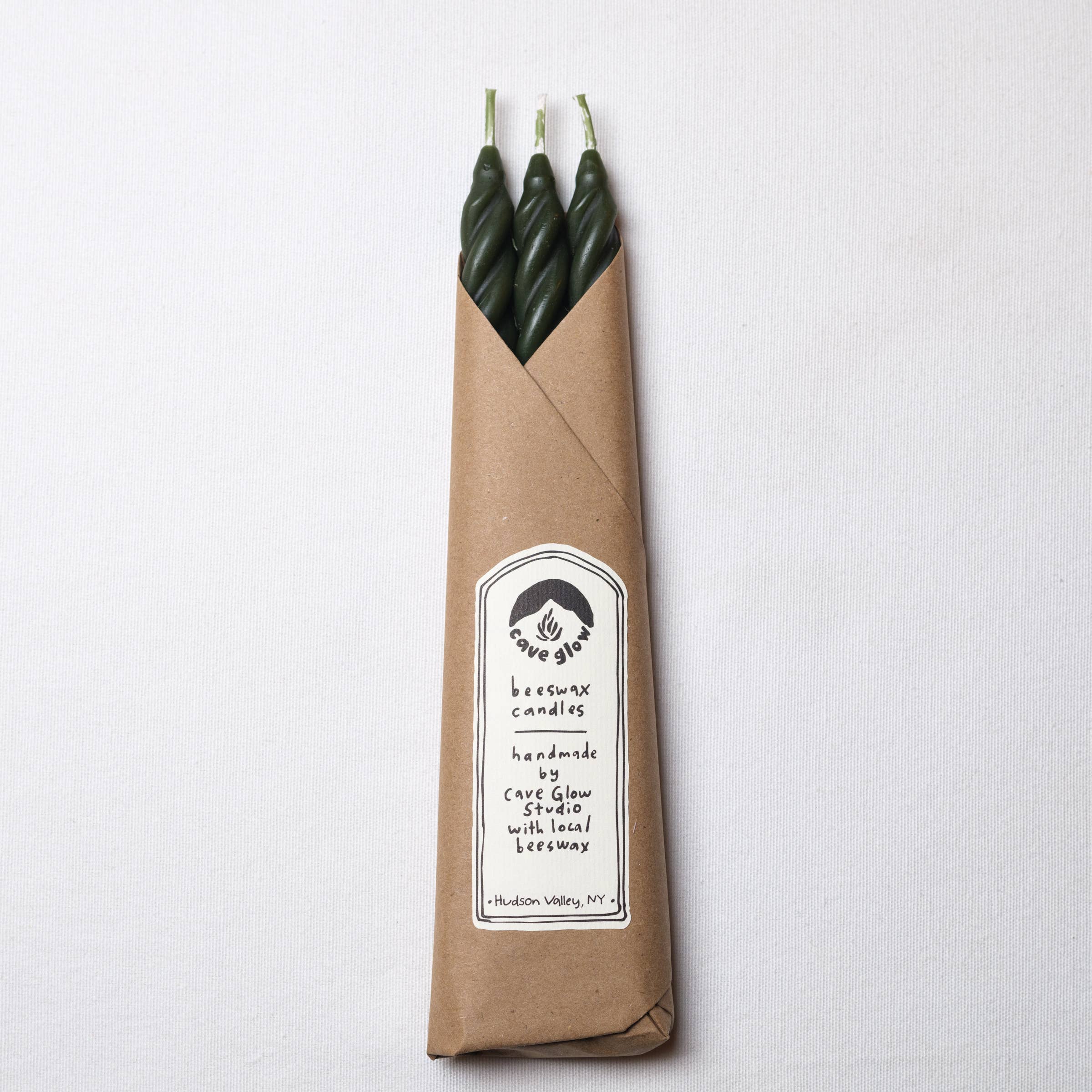 Set of four Pine Beeswax Spiral Taper Candles by Cave Glow Studio, featuring natural beeswax with spiral design.