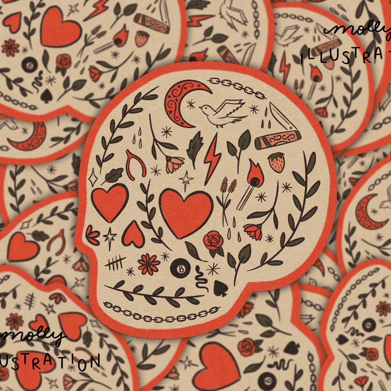 A close-up of multiple overlapping skull-shaped stickers or cards with a tattoo-style illustration. The central piece shows red hearts, black floral and line motifs, and a red border on a warm cream background.