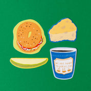 Illustrated bagel, coffee cup, and pastry on a green background