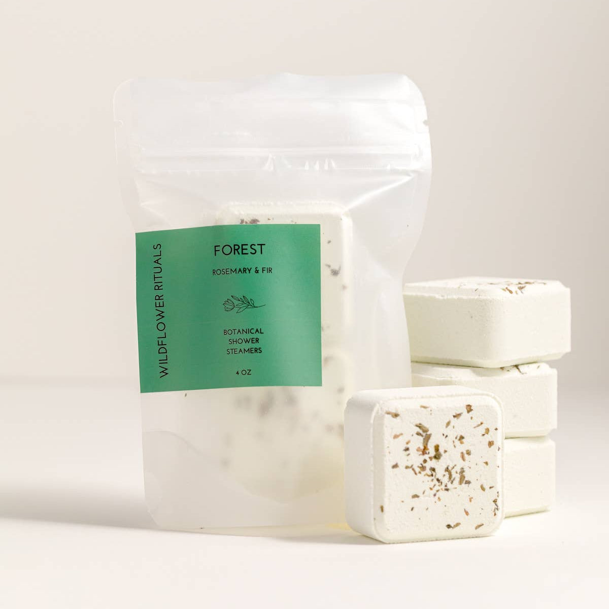 Packaged Wildflower Rituals Forest Rosemary & Fir shower steamers on a light background