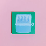Card with a blue illustration of a fishbowl containing three fish on a pink background