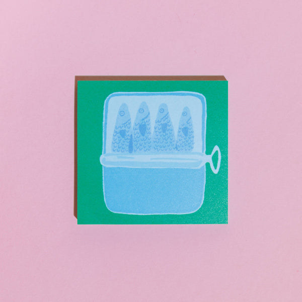 Card with a blue illustration of a fishbowl containing three fish on a pink background