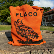 Flaco Tote Bag by Burring Books, displayed in a park setting, showcasing its stylish design and durable material.