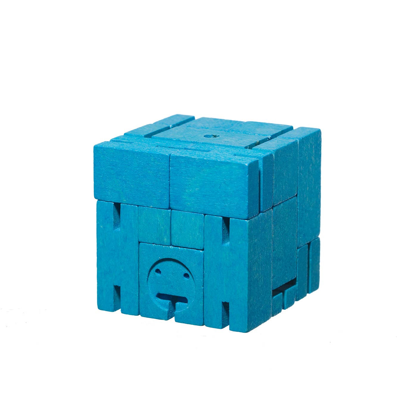 Blue toy block with a face design on a white background