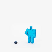Blue robot toy figure on a white background