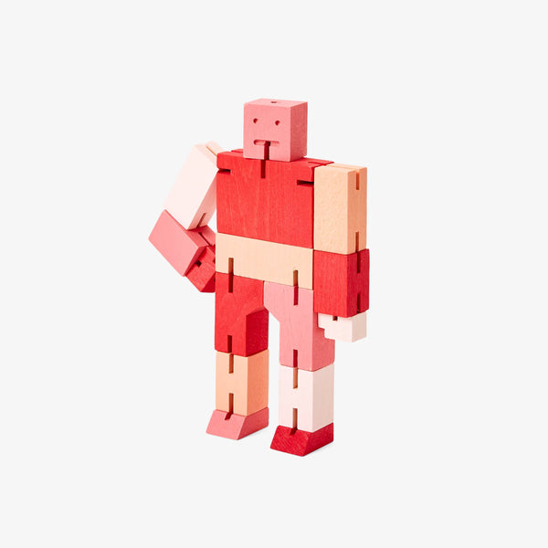 Red and beige robot-like figure made of interlocking bricks on a white background