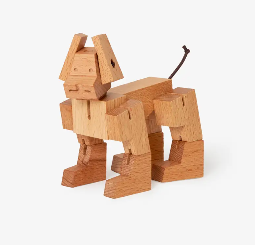Wooden dog toy on a white background