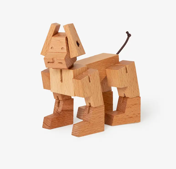 Wooden dog toy on a white background
