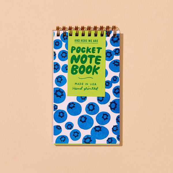 Pocket notebook with blueberry pattern on a beige background