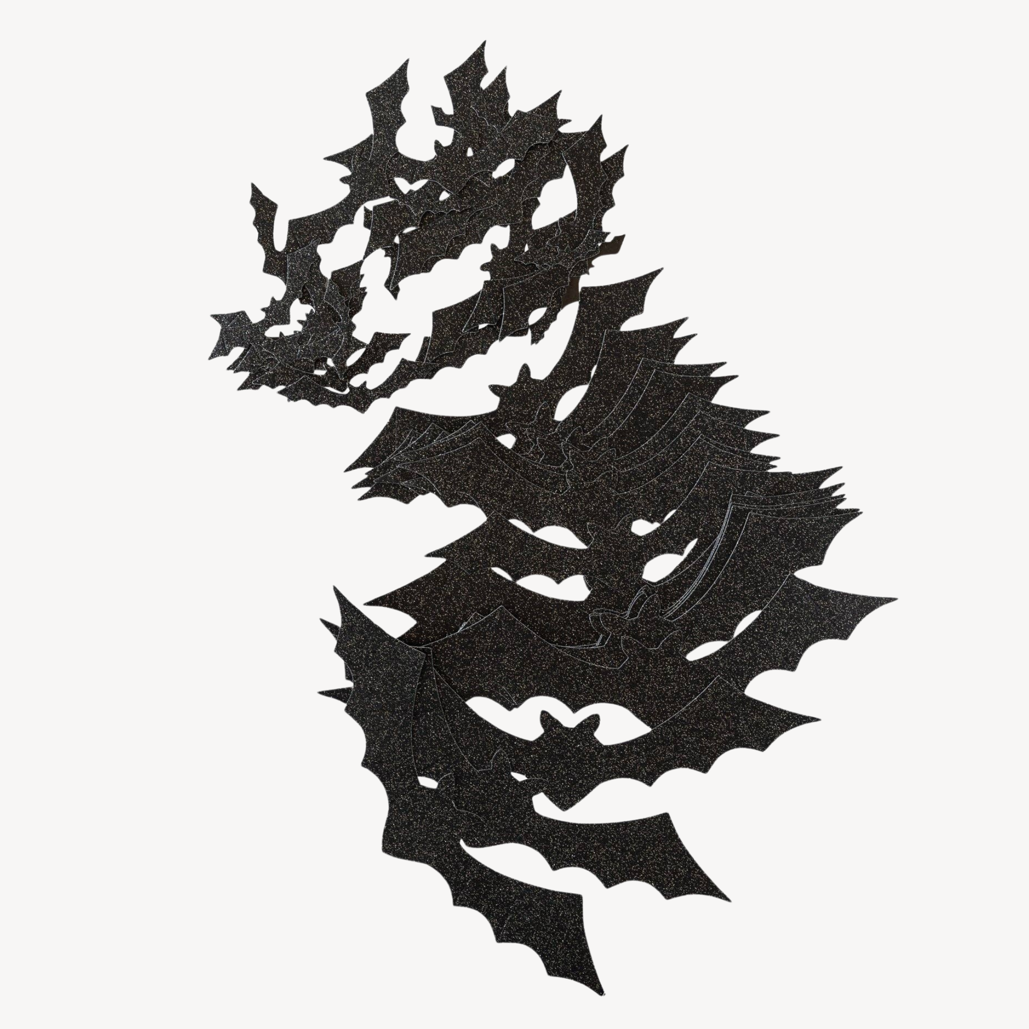 A pile of black bat cutouts against a white background.