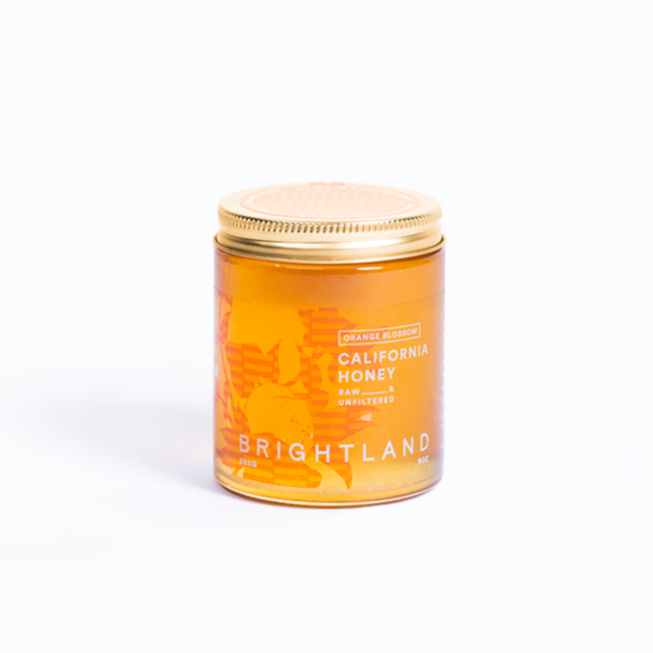 Jar of Brightland California Honey on a white background