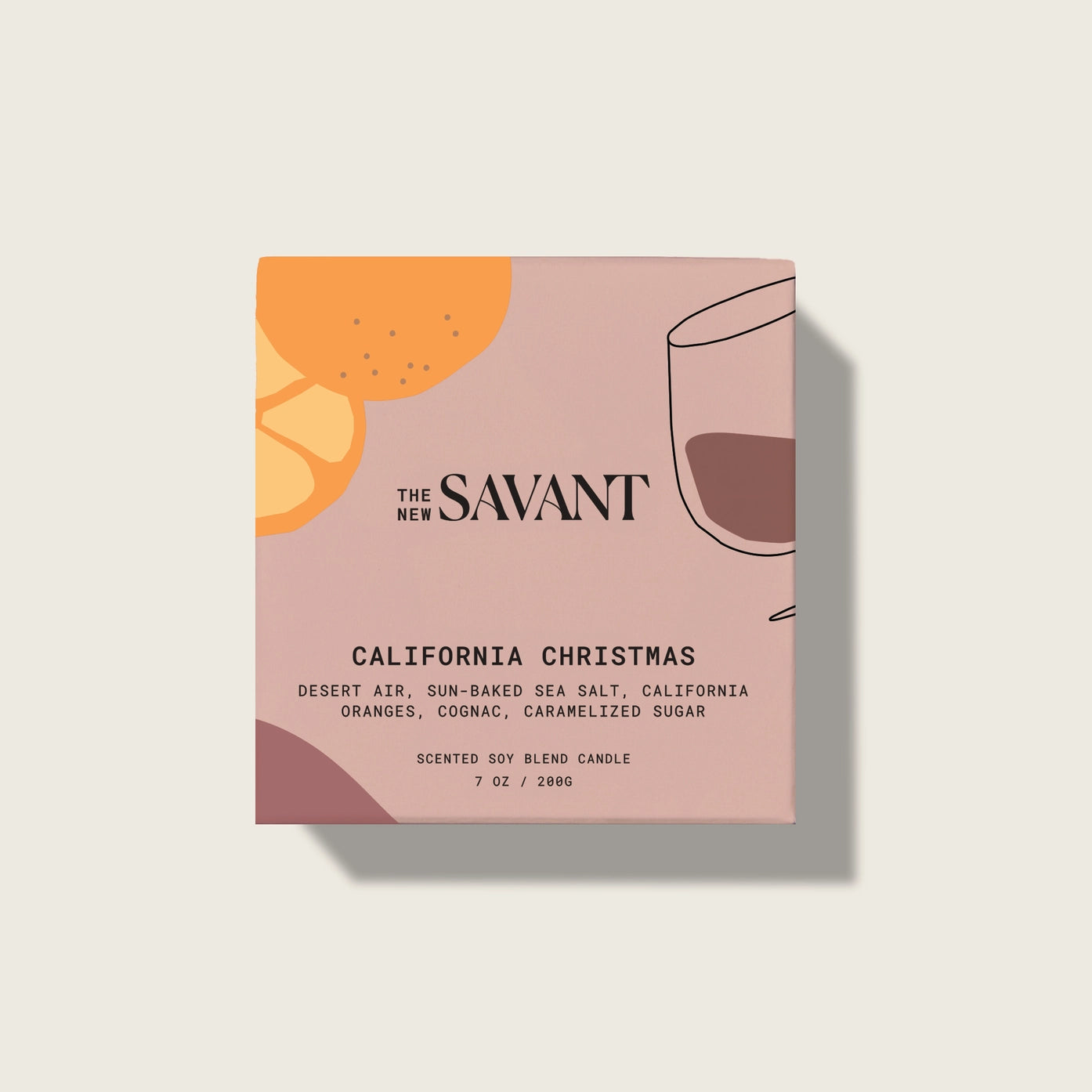 Savant candle packaging with illustrations of oranges and a glass on a beige background