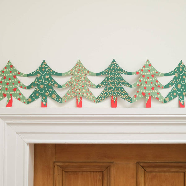Decorative paper Christmas trees above a door
