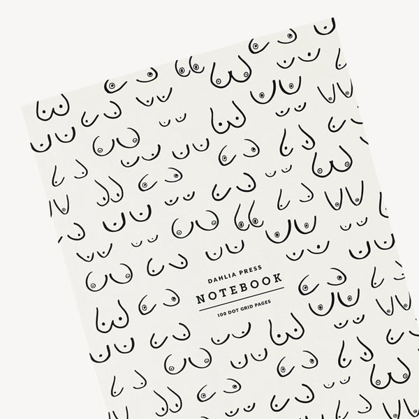 Notebook with grid pattern and 'Dahlia Press' branding on a white background