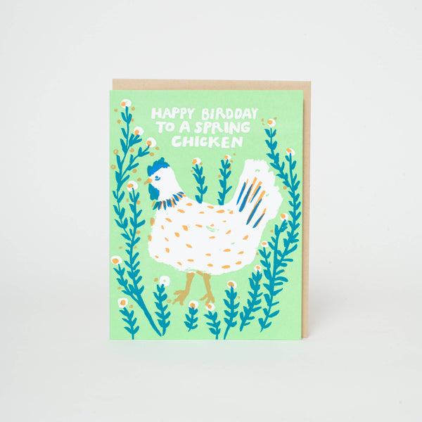 Spring Chicken greeting card by Egg Press Manufacturing featuring a colorful illustration of a cheerful spring chicken.
