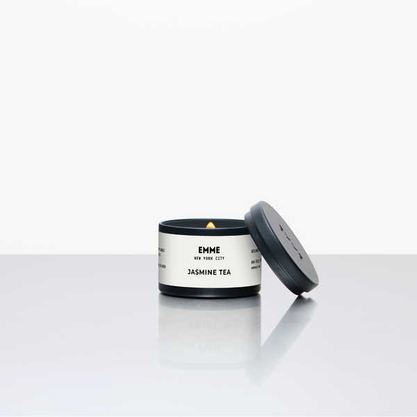 Candle with a white label on a light gray background