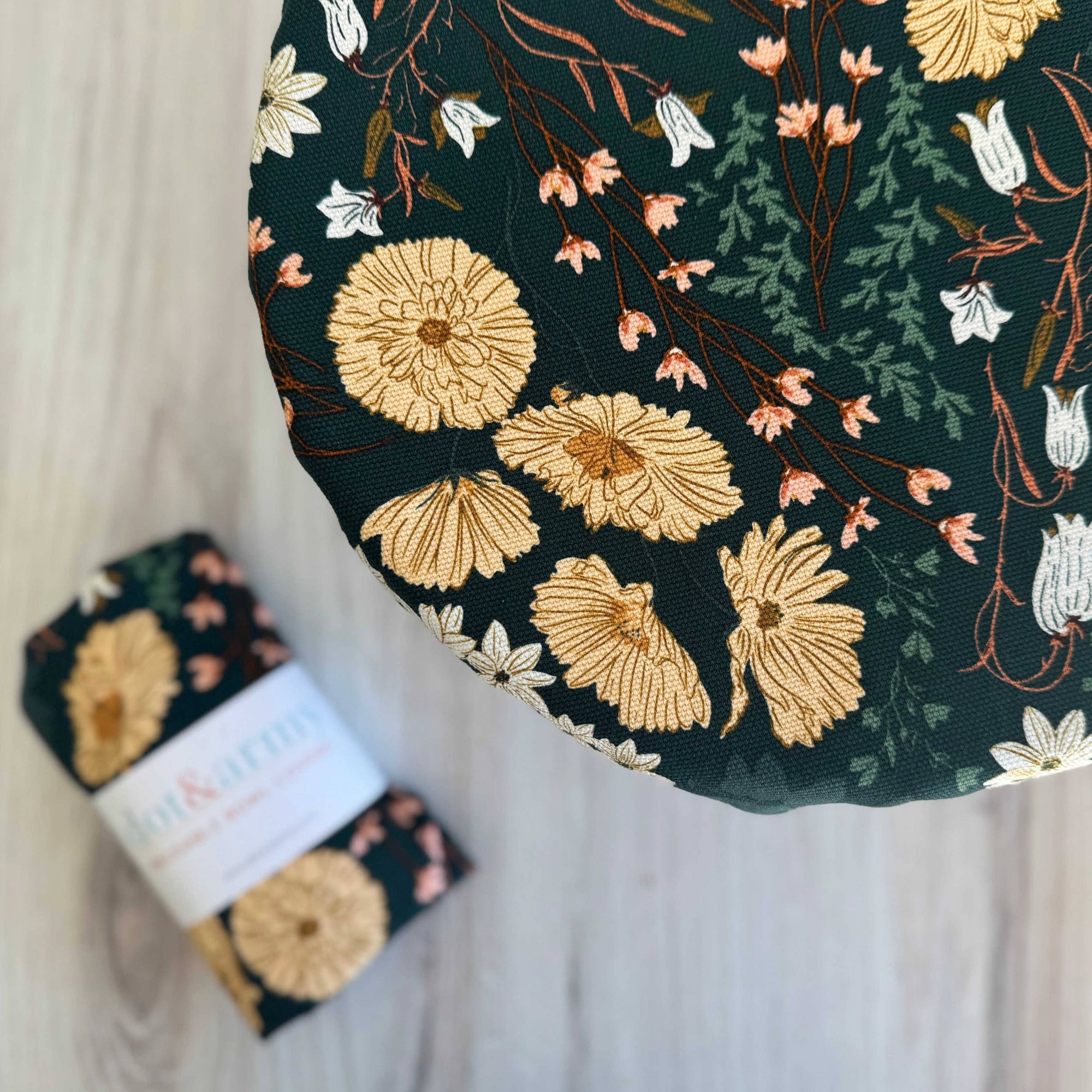 Floral patterned bowl cover on a light background