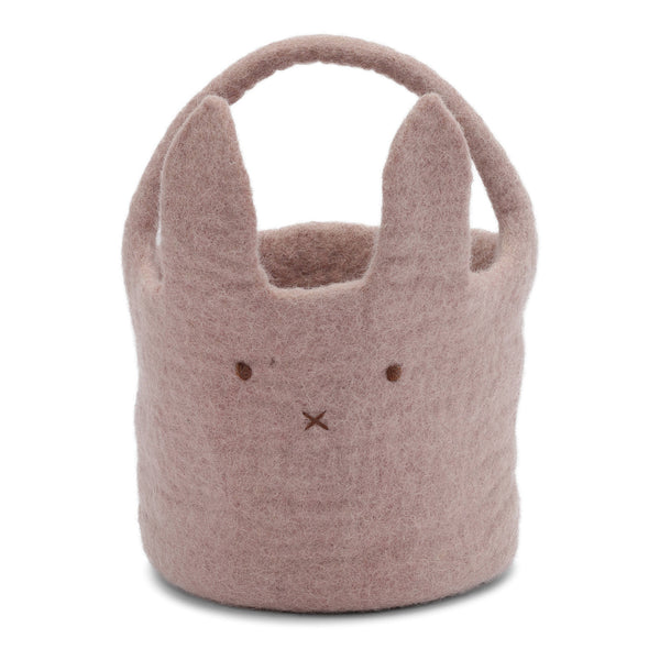 Pink felt basket with bunny ears and face on a white background