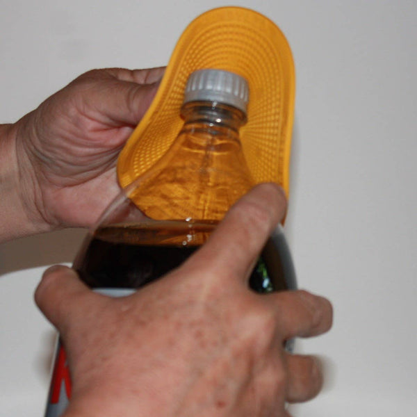 Person using a yellow bottle opener on a bottle against a white background