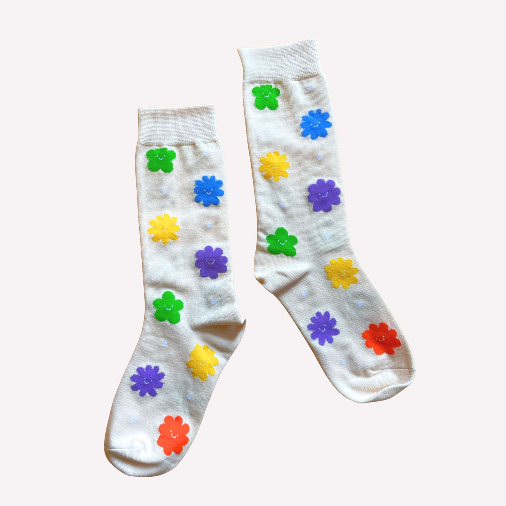 White socks with colorful flower patterns on a white background