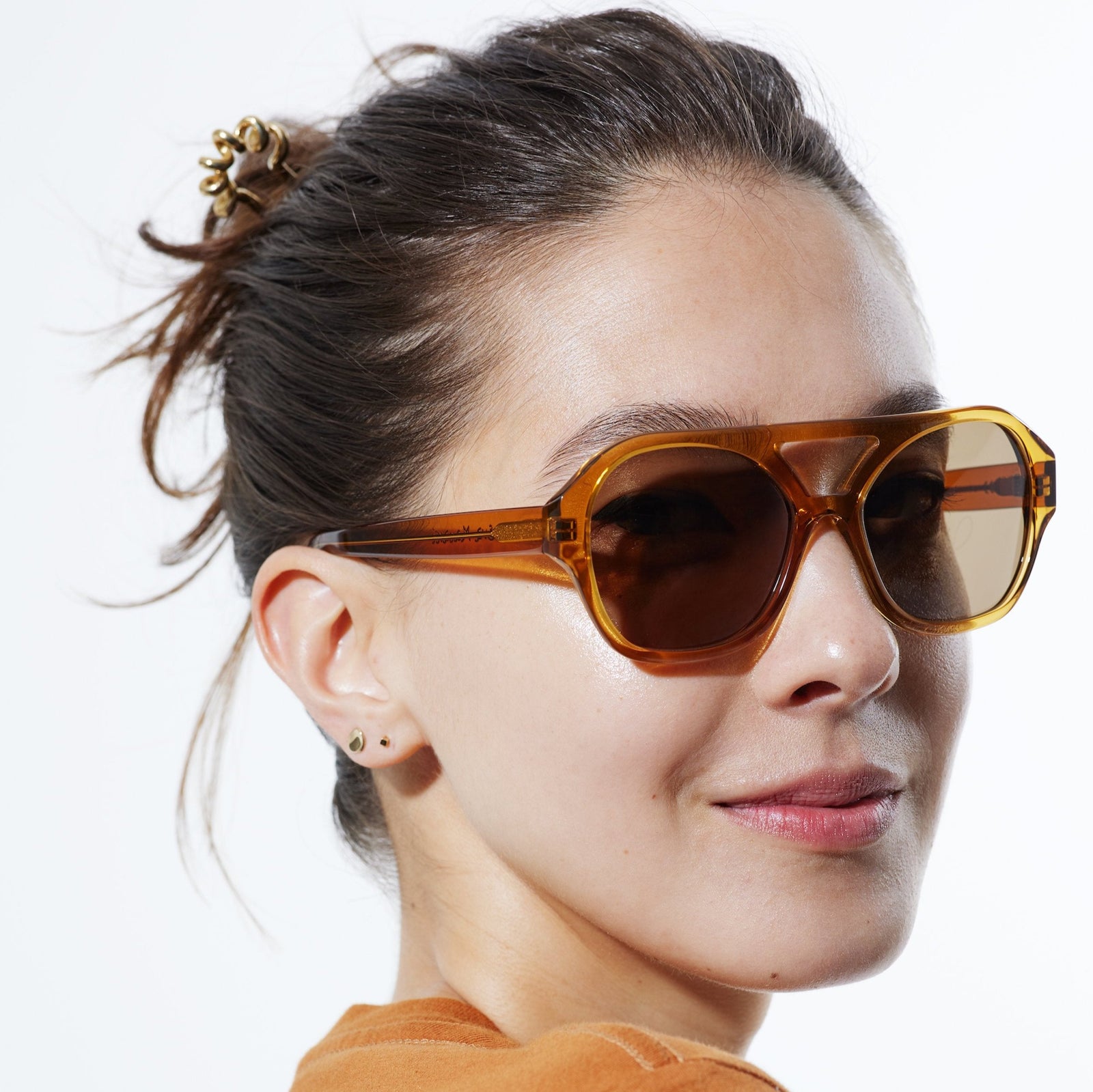 a picture of a woman wearing the chiyo honey sunglasses