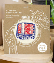 Box for a complete embroidery kit with 'hook, line & tinker' branding.