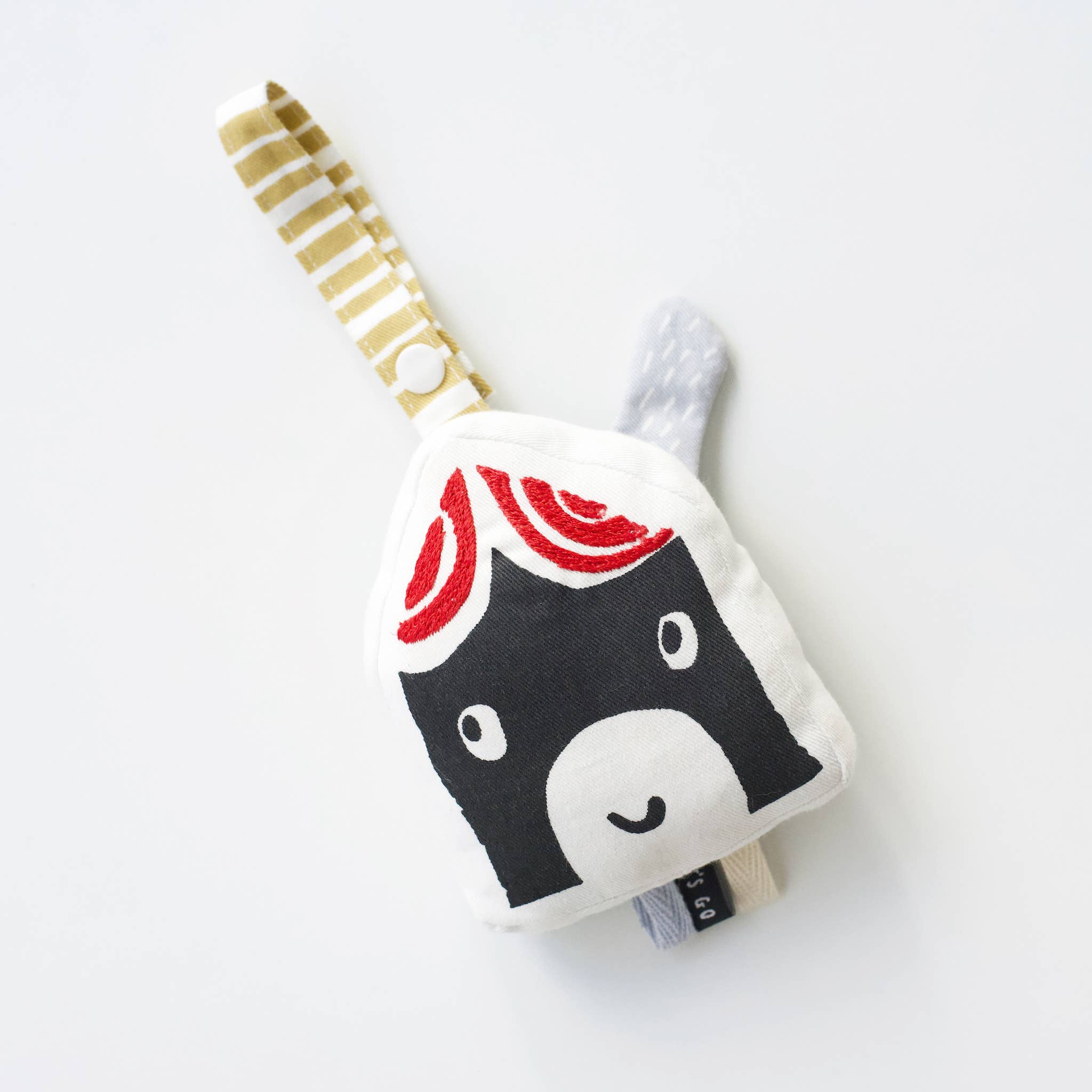 Toy resembling a house with smoky chimney on a white background