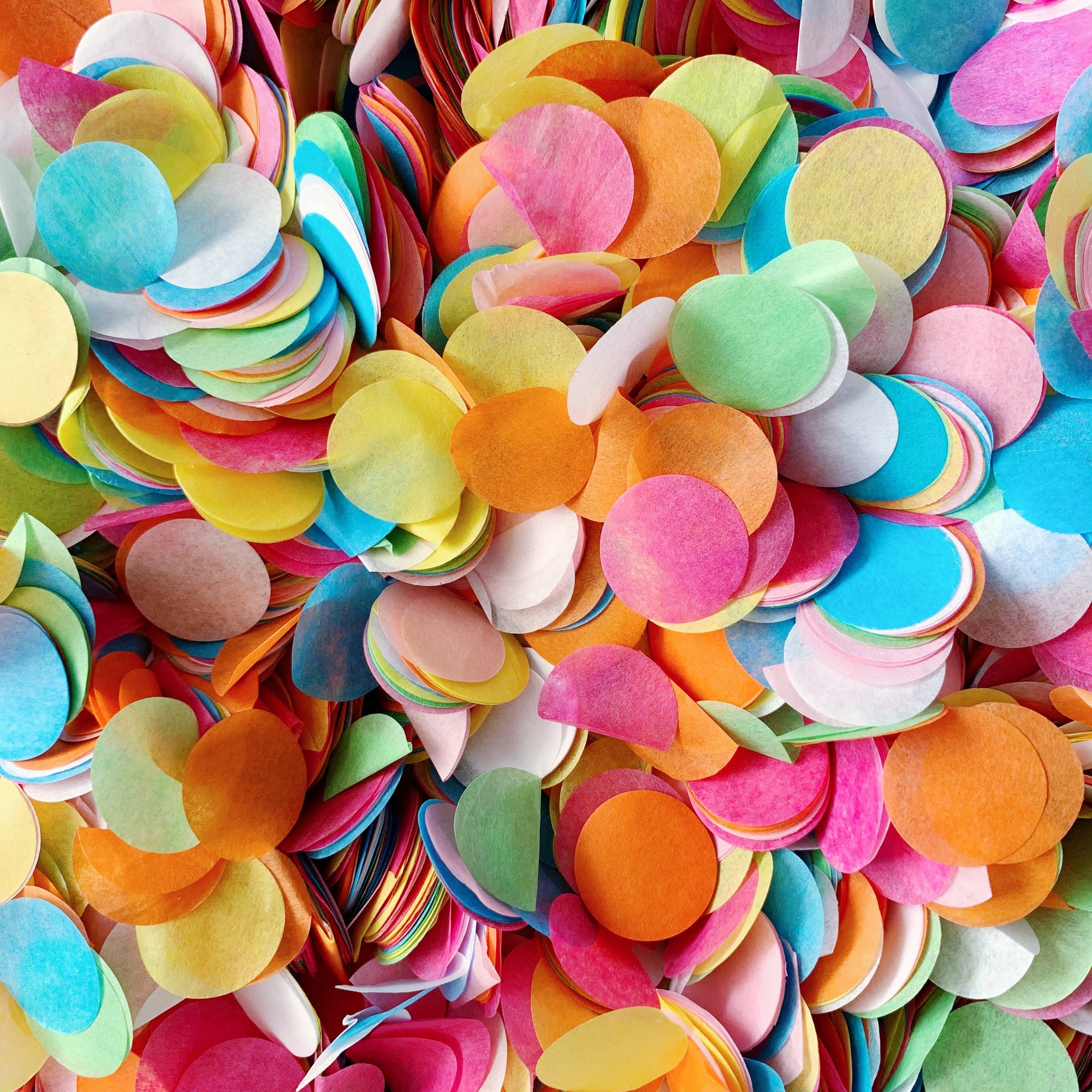 Multicolored confetti pieces in various shapes and sizes.