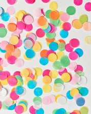 Colorful confetti dots on a white background