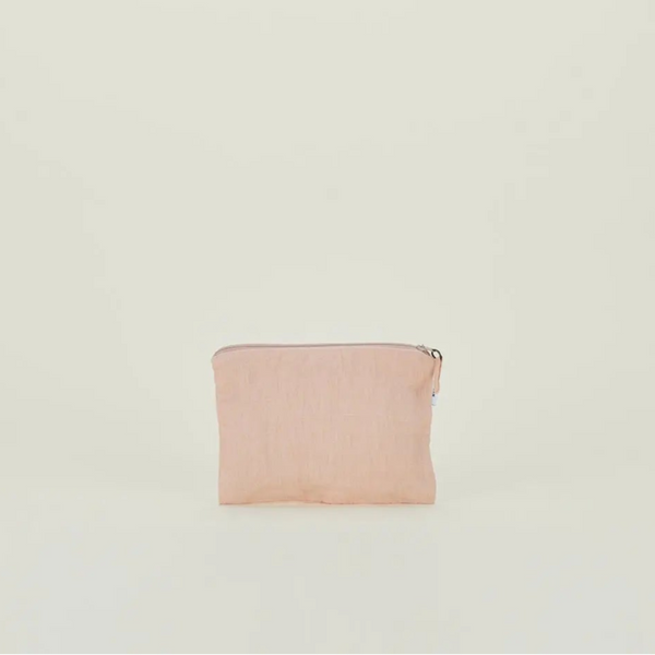 Pink pouch on a light beige background