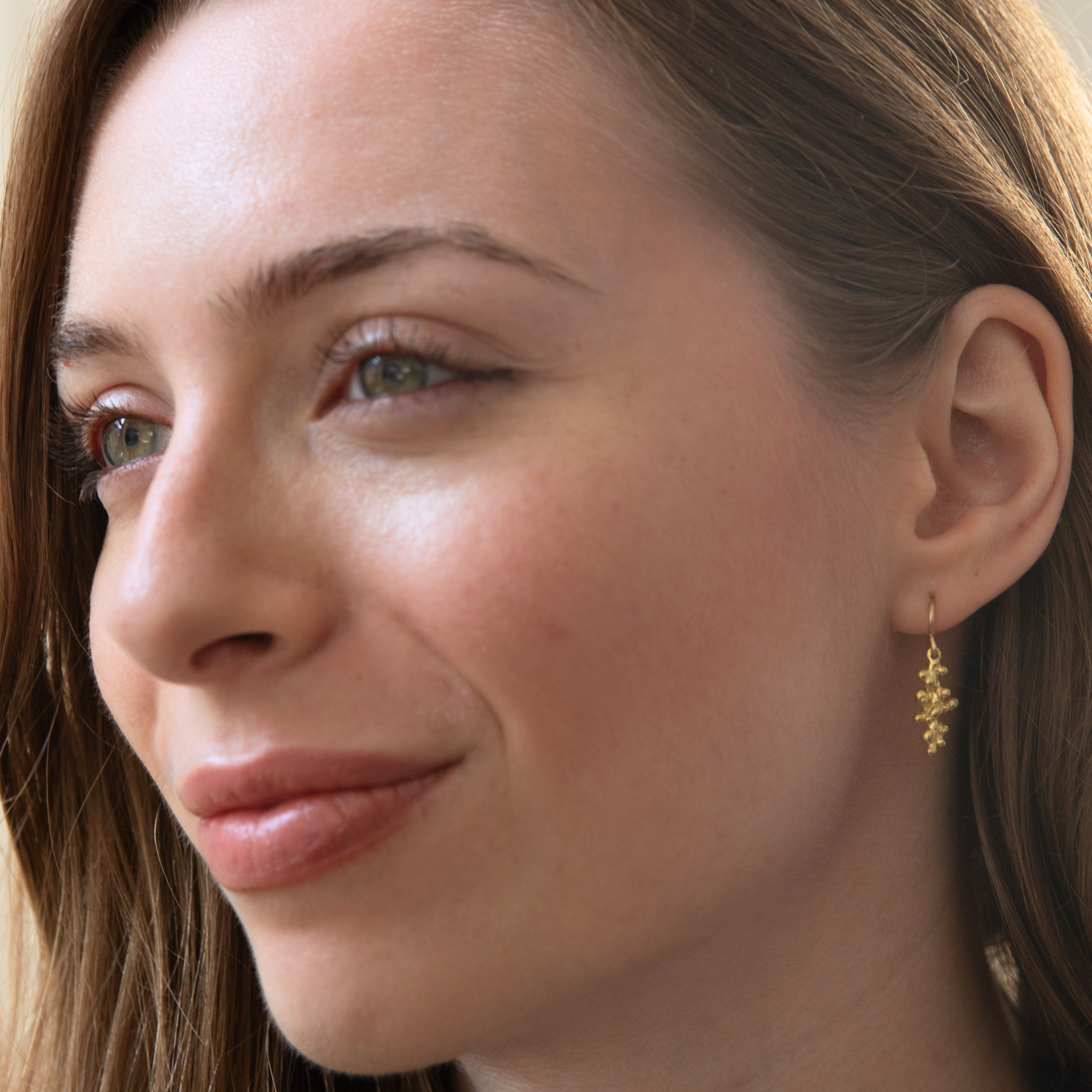 Gold Budding Twigs Earrings by Lisa Medoff Designs featuring a delicate twig design with intricate detailing.