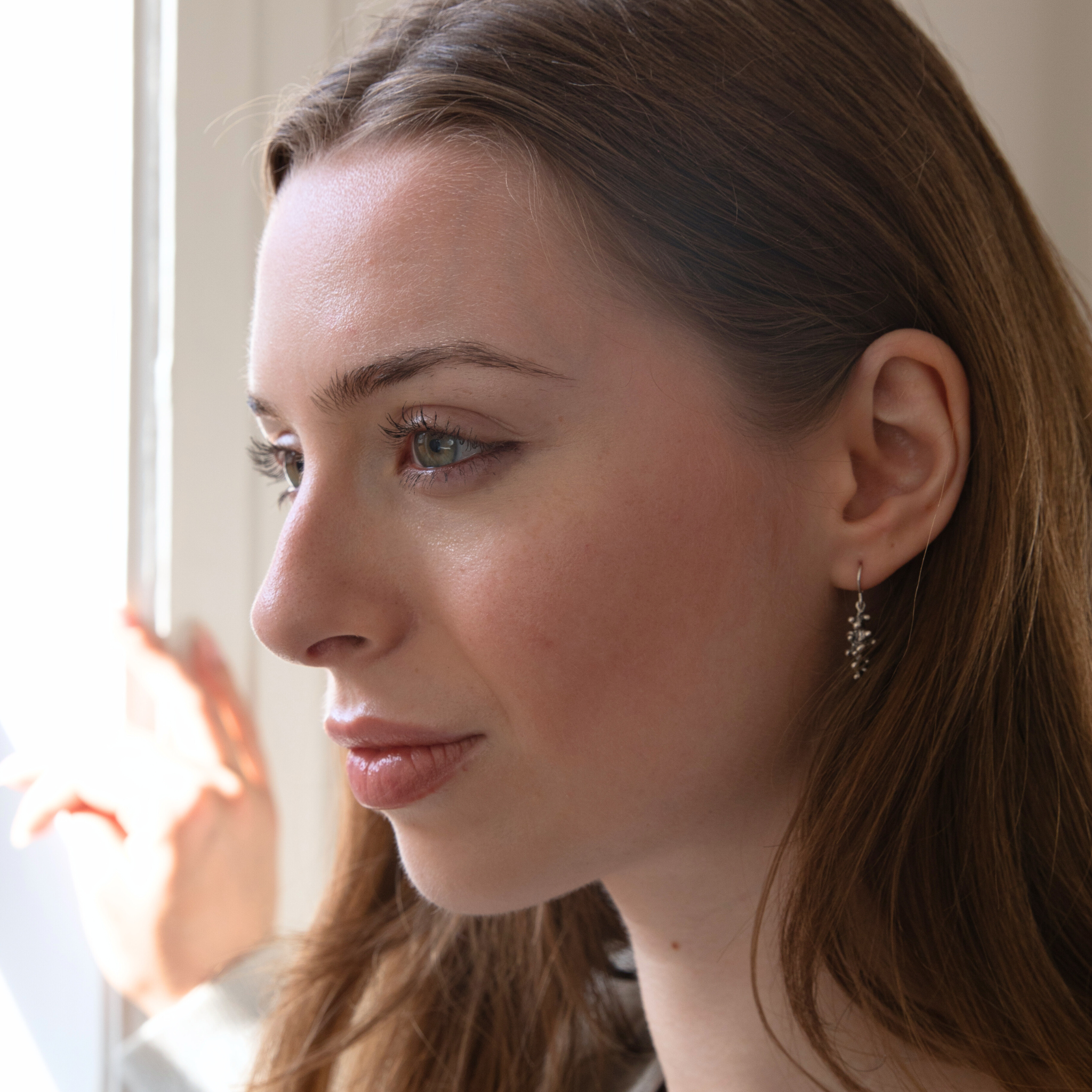 Budding Twigs Earrings by Lisa Medoff Designs featuring intricate twig-like sterling silver designs.