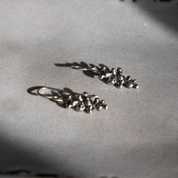 Budding Twigs Earrings by Lisa Medoff Designs, featuring intricate sterling silver twig designs for a natural look.