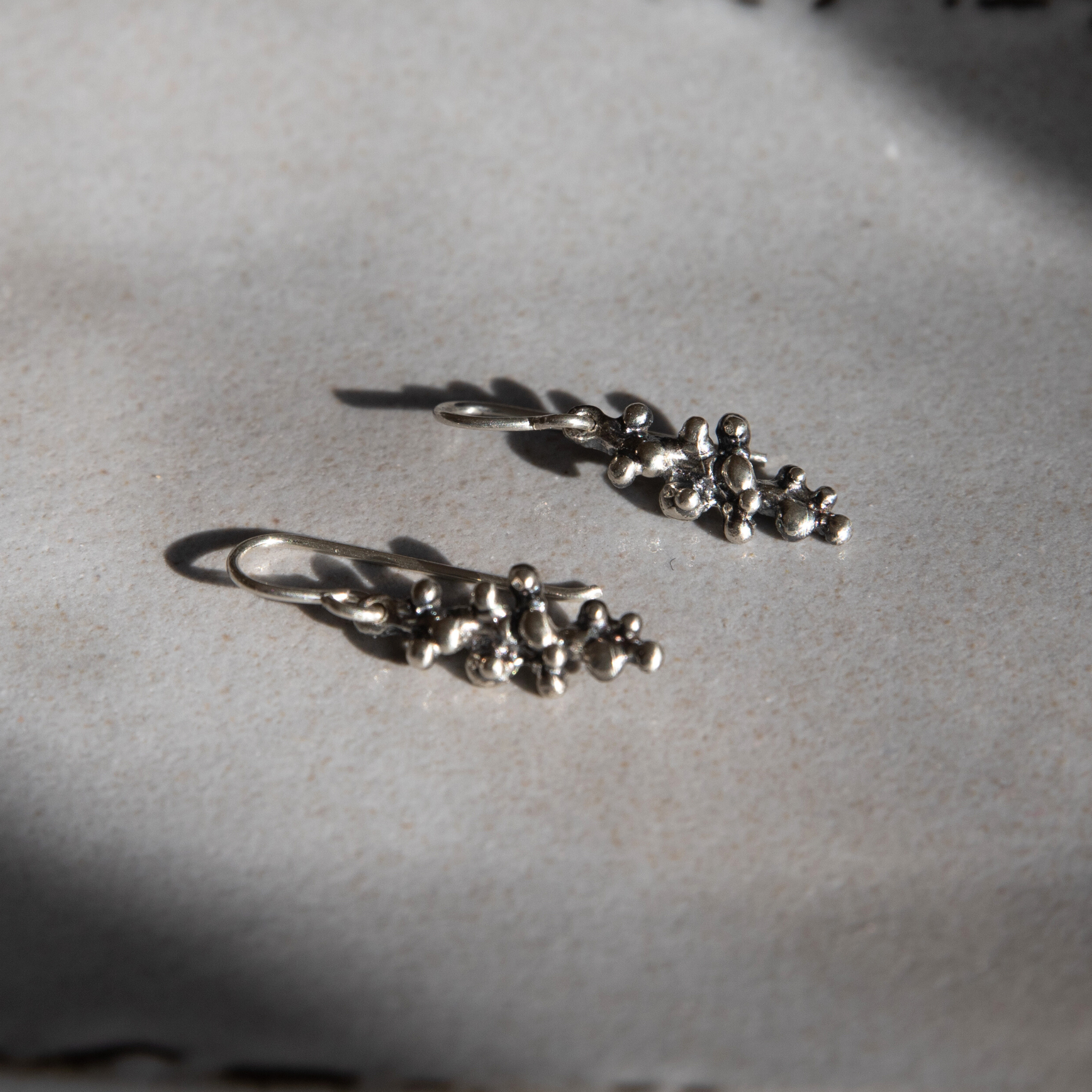 Budding Twigs Earrings by Lisa Medoff Designs, featuring intricate sterling silver twig designs for a natural look.