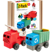 Two toy trucks, one red and one blue with a green bed, in front of their packaging.